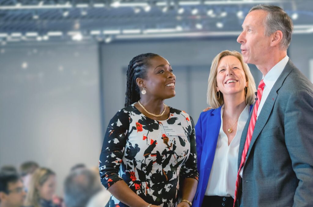 Three people talking during a conference